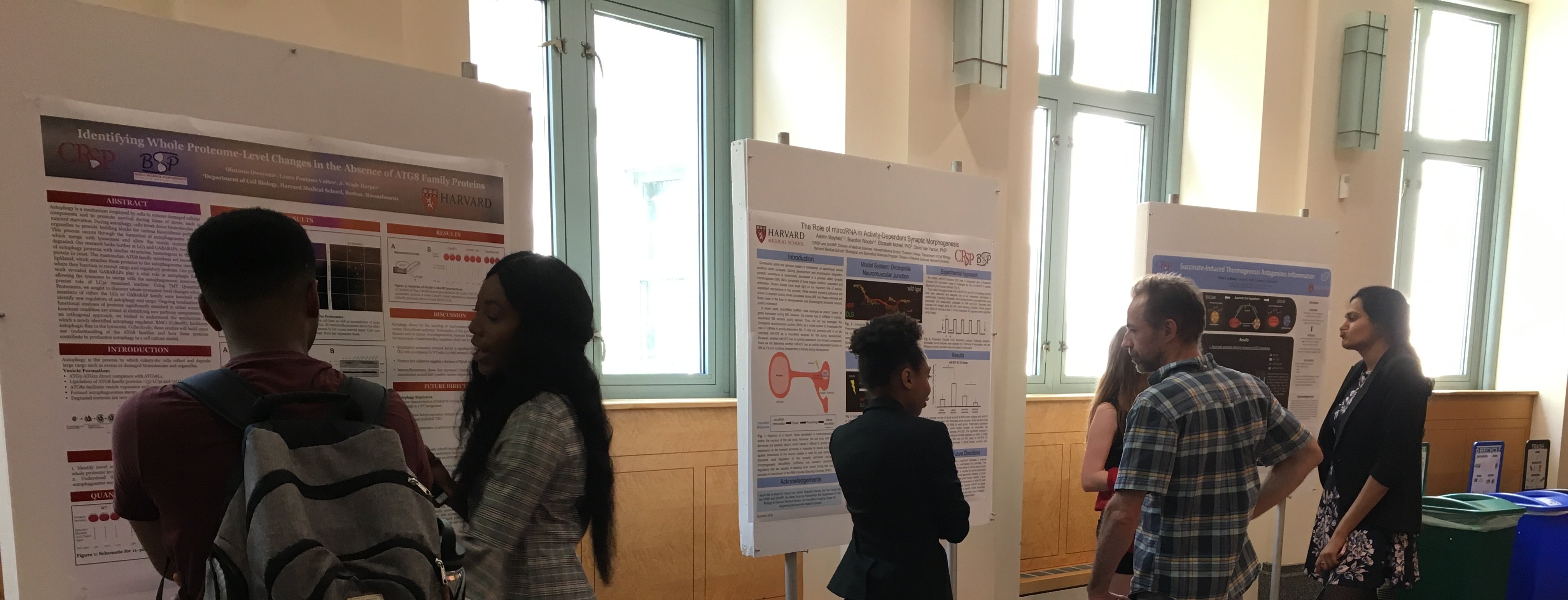 CRSP students present their summer research at a poster session.