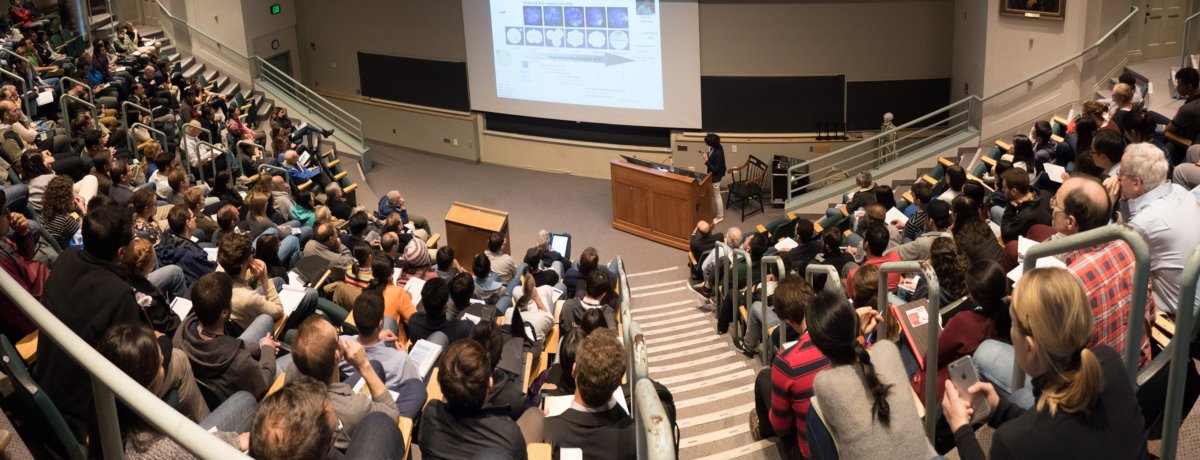 2018 Fawcett Lecturer honoree Edith Heard, Ph.D., presents her research to a packed auditorium of researchers.