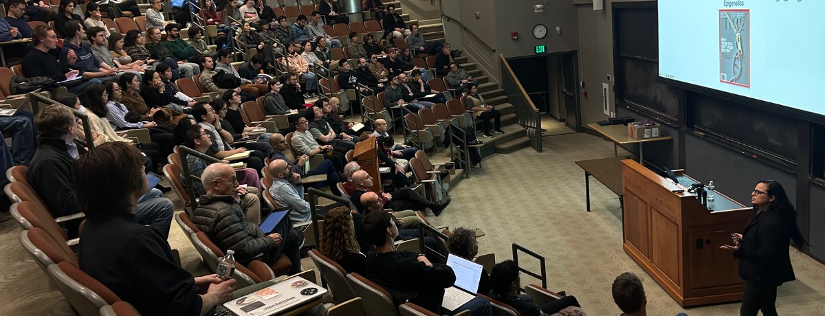 A crowd of people watching our Cell Bio Seminar speaker present in the Armenise Amphitheater